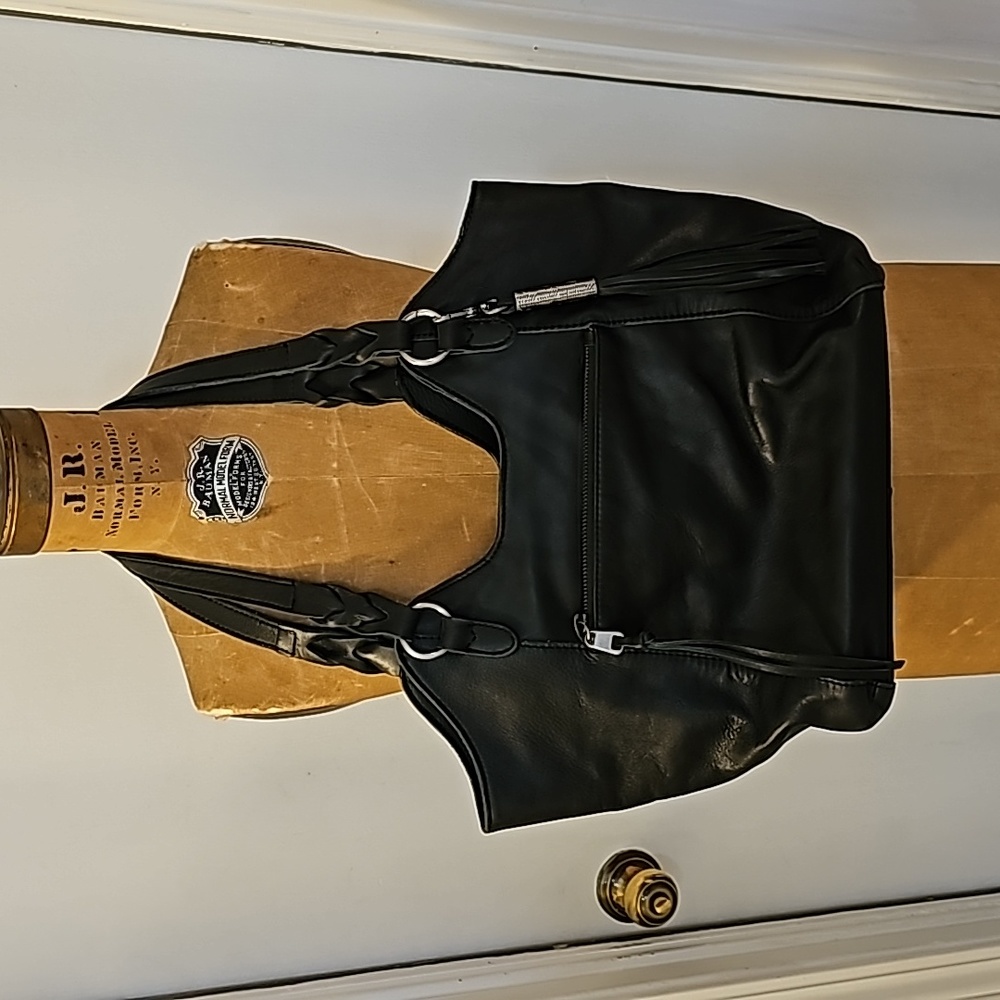 The Sak Leather Shoulder Purse with Tassell Charm. Black. Multi pocket.
